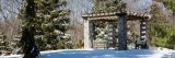 snow covered gazebo in the ornamental confers