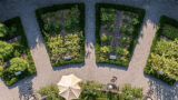 An aerial view of a sunny, arch-shaped vegetable garden in segments