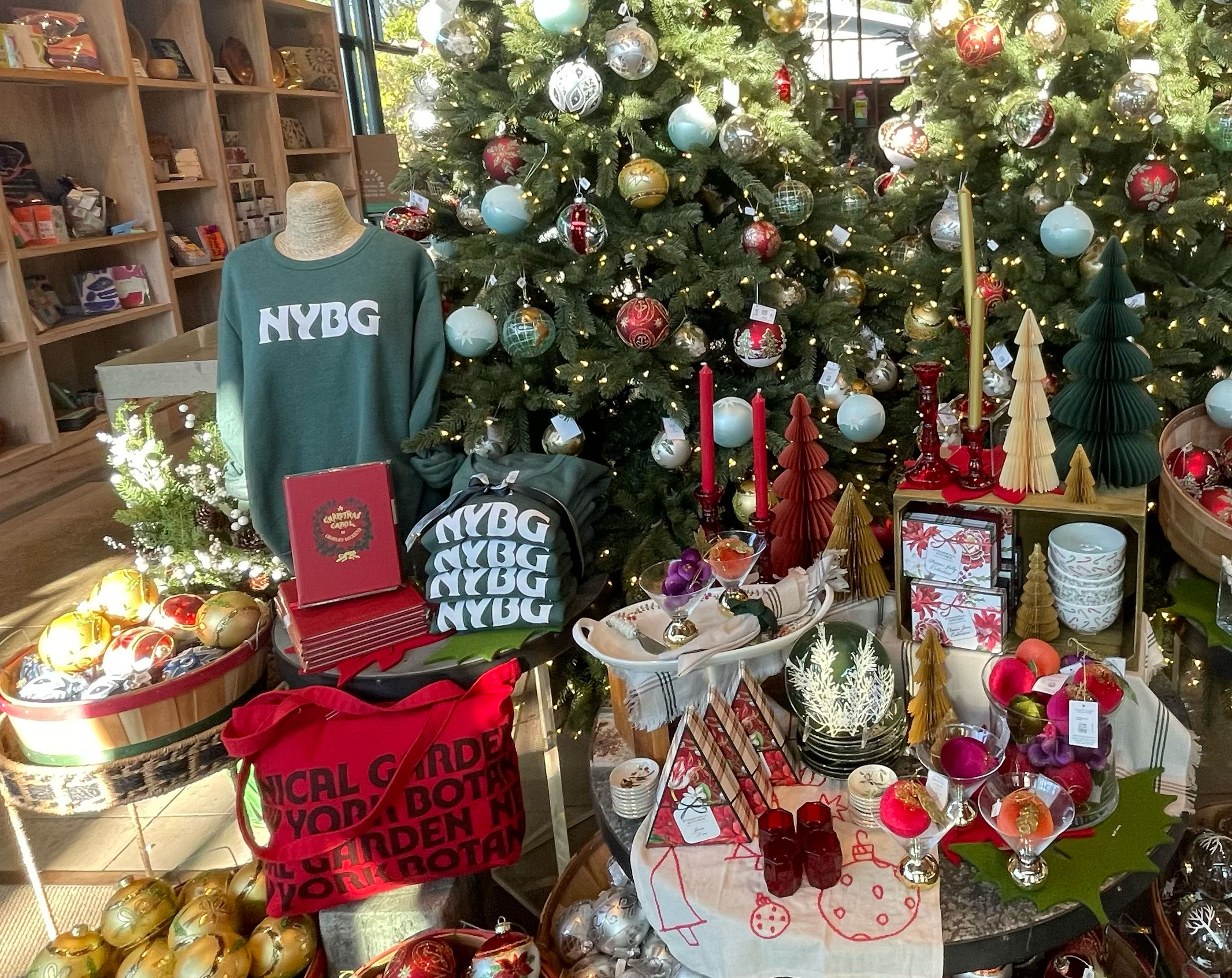 A selection of green and red holiday goods arranged in a brightly lit shop setting